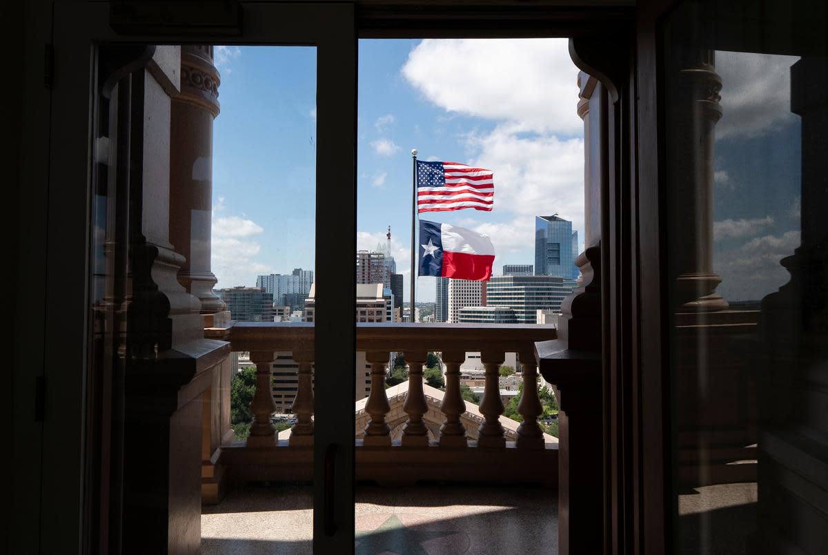 A view of the U.S. and Texas flags flown on the south side of the Texas Capitol from the Capitol Dome in Austin on Aug. 12, 2021.