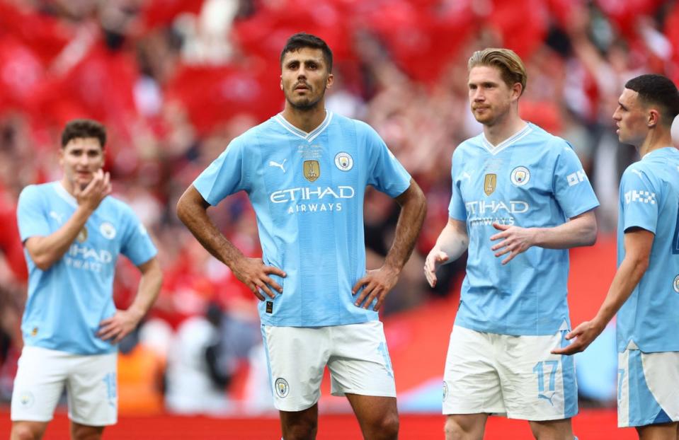 Manchester City are big favourites to win the Premier League but there is a cloud hanging over their season with a legal case over rule breaches coming to a head. (REUTERS)