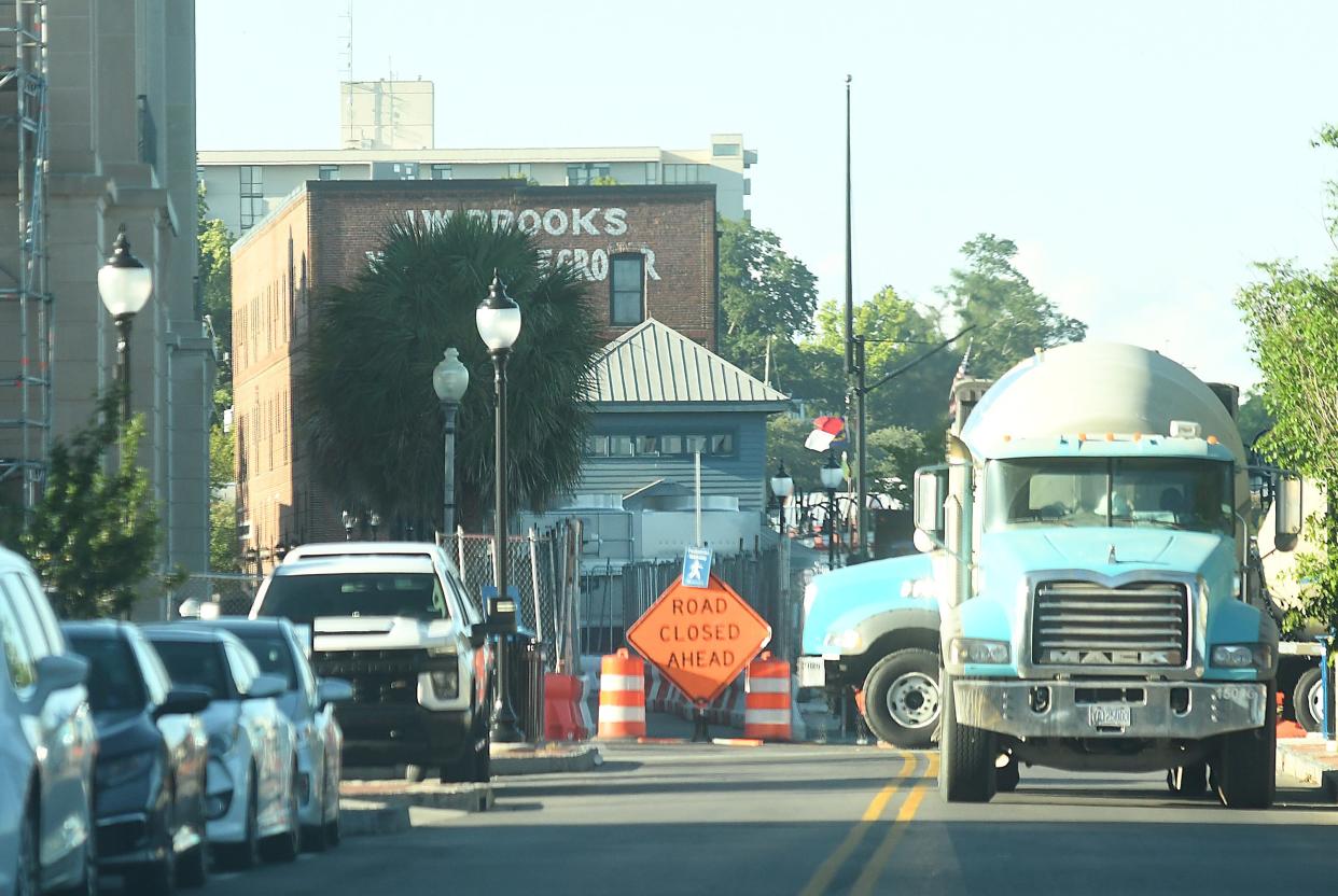 Crews continue to work at the corner of Water and Princess Streets along the riverwalk. Construction on Wilmington's riverwalk was supposed to wrap up this summer but appears to still be underway Friday June 24, 2022 in Wilmington, N.C.