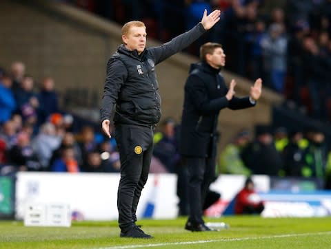 Celtic manager Neil Lennon (left) and Rangers manager Steven Gerrard instruct their players during the Betfred Scottish Cup Final at Hampden Park - Credit: Jeff Holmes/PA Wire