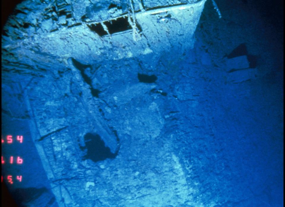 This is a view looking down on the deck of the R.M.S. Titanic between the number 2 and number 3 stack where the deck suddenly hinges downward at right towards the tear, at which point the stern separated from the rest of the ship. 