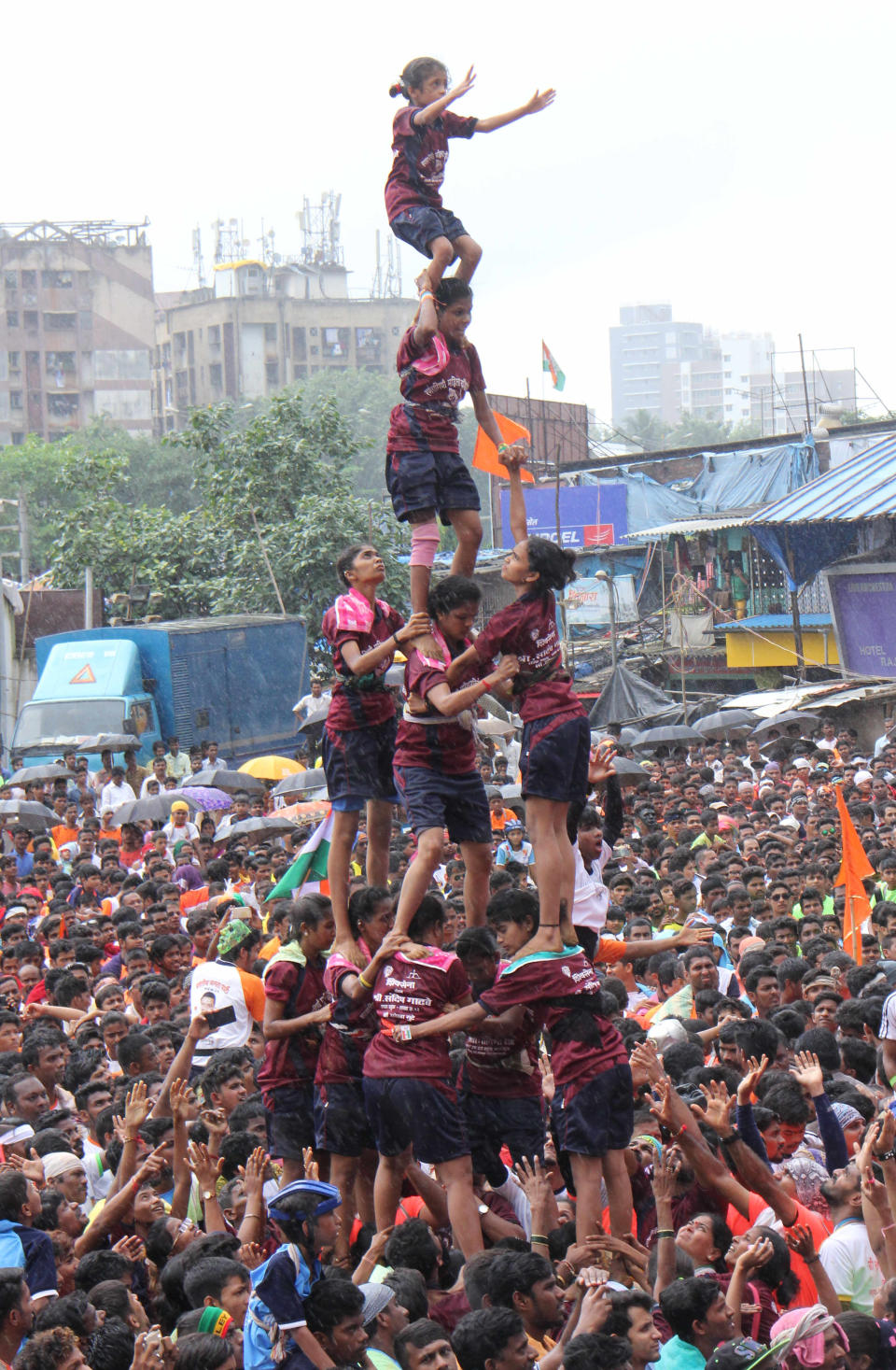 <p>Women from Mumbai form a human pyramid to break the’ dahi-handi’, a curd-pot suspended above during celebrations of the Hindu festival of ‘Janmashtami’. </p>