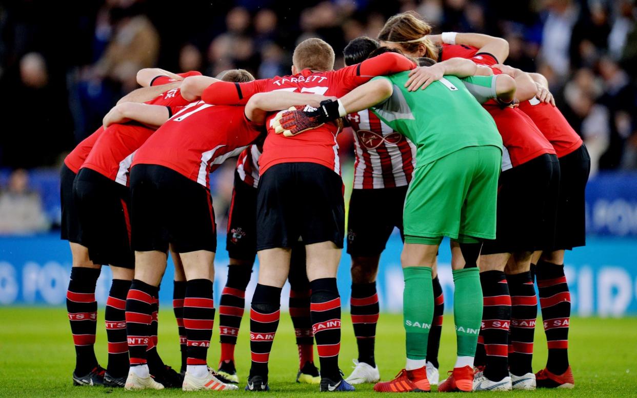 Southampton players form a huddle - REUTERS