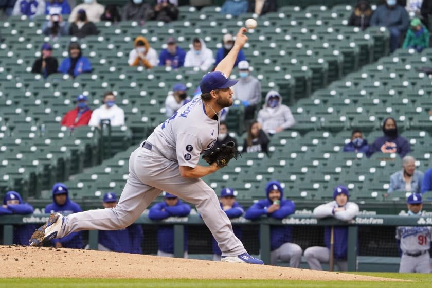 Los Angeles Dodgers starting pitcher Clayton Kershaw throws the ball against the Chicago Cubs during the first inning of the first baseball game of a doubleheader Tuesday, May, 4, 2021, in Chicago. (AP Photo/David Banks)