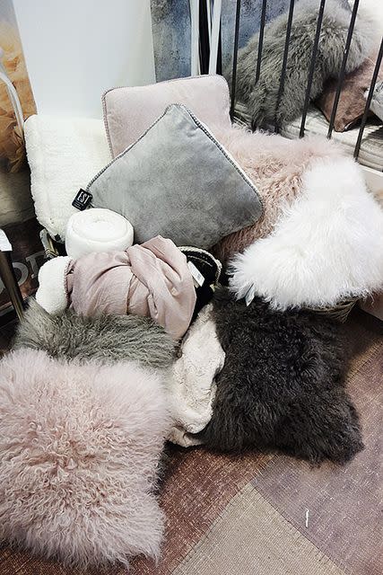 Invest in some textured cushions in materials such as faux fur and velvet, they looks tres chic and feel all snuggly.