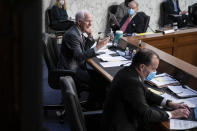 Sen. Mike Lee, R-Utah, listens as Sen. John Cornyn, R-Texas, questions Supreme Court nominee Amy Coney Barrett during the third day of her confirmation hearings before the Senate Judiciary Committee on Capitol Hill in Washington, Wednesday, Oct. 14, 2020.(Sarah Silbiger/Pool via AP)