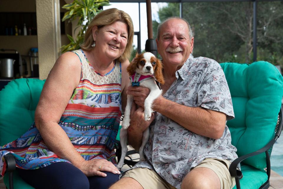 Louise and Richard Wilbanks pose for a portrait with their dog Gunner, Monday, Nov. 23, 2020, at their home in Estero.