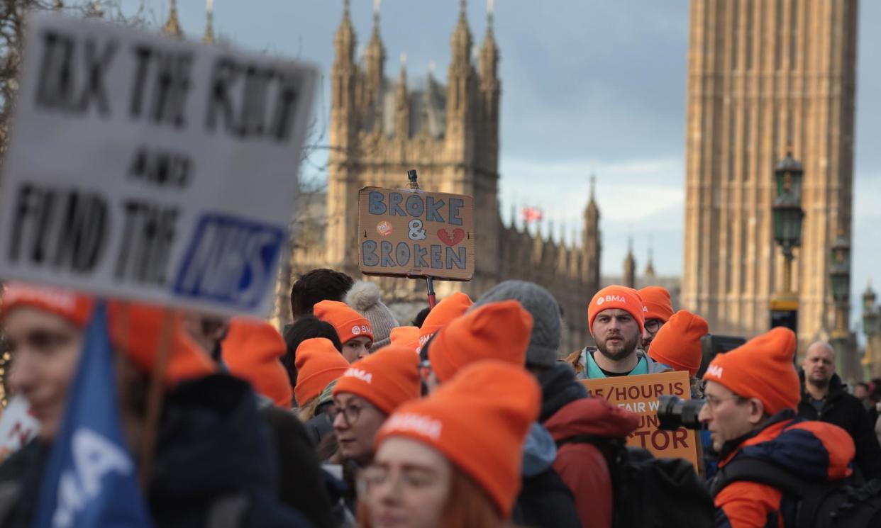 <span>Junior doctors begin their six-day strike in January outside St Thomas’ hospital in London.</span><span>Photograph: Martin Godwin/The Guardian</span>