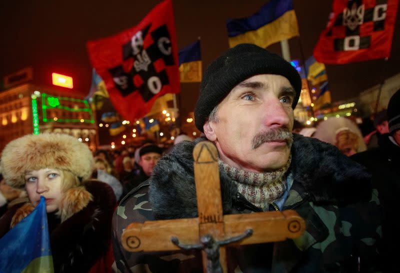 FILE PHOTO: Pro-European integration protesters attend a rally in central Kiev in December 2013