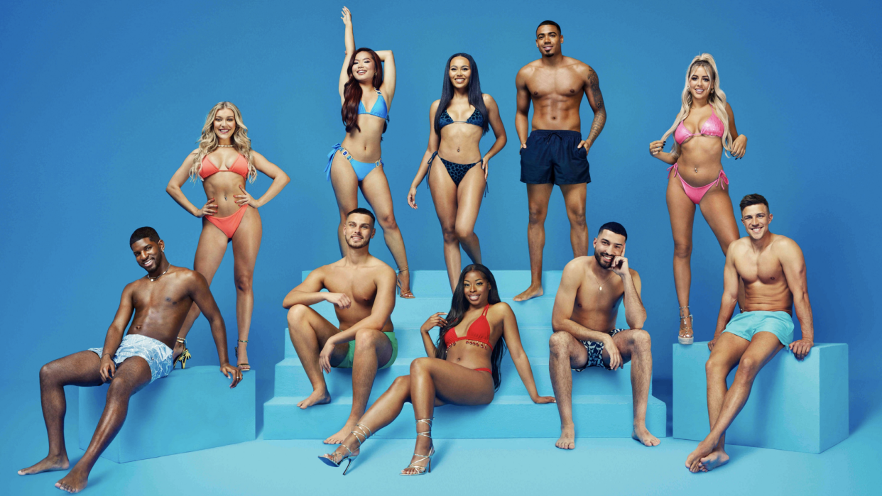  Love Island season 10 cast posing in beachwear on a blue background ahead of the show's launch 