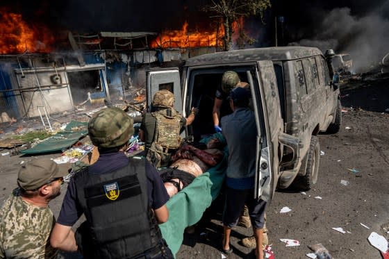 Paramedics help a wounded man after a Russian rocket attack in the eastern Ukrainian city of Kostiantynivka on Sept. 6, 2023.<span class="copyright">Evgeniy Maloletka—AP</span>