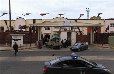 A view of the entrance of al-Hadba prison, where the trial of Muammar Gaddafi's sons Saadi Gaddafi and Saif al-Islam more than two dozen of his ex-officials are being held in Tripoli April 14, 2014. REUTERS/Ismail Zitouny