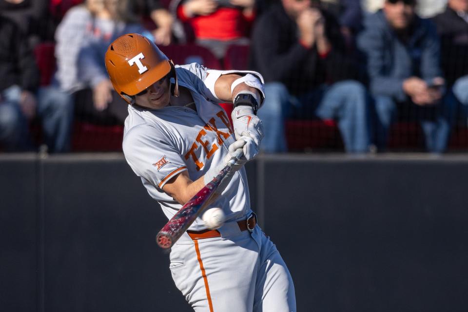 Texas catcher Rylan Galvan connects with the ball during Saturday's 22-8 win over Texas Tech in their Big 12-opening series in Lubbock. The Longhorns won two of the three games and moved up one spot to No. 23 in this week's top-25 poll.