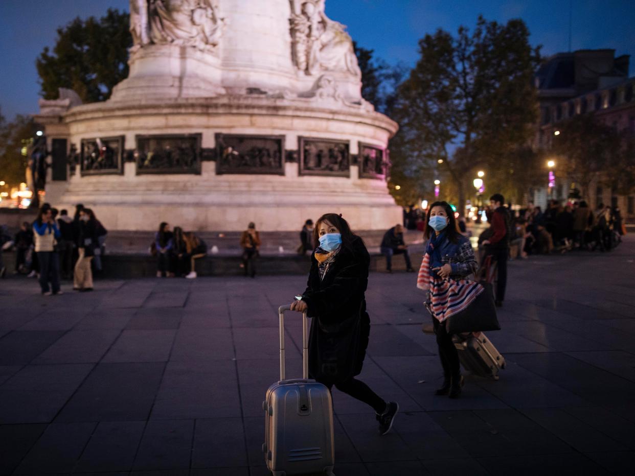 Tourists in Paris' walking in Place de la République