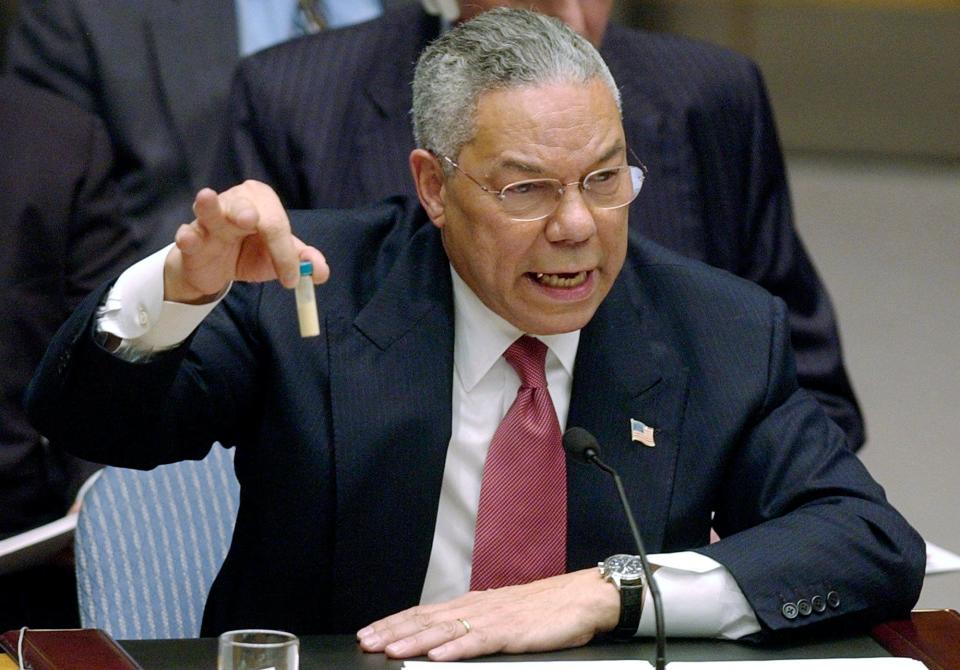 In this Feb. 5, 2003 file photo, Secretary of State Colin Powell holds up a vial he said could contain anthrax as he presents evidence of Iraq's alleged weapons programs to the United Nations Security Council.