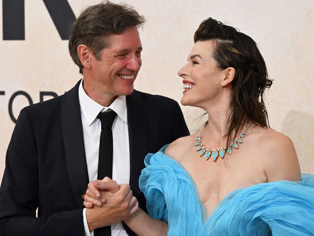 <p>Stefano Rellandini / AFP / Getty</p> Milla Jovovich and Paul W. S. Anderson attend the annual amfAR Cinema Against AIDS Cannes Gala on May 26, 2022.