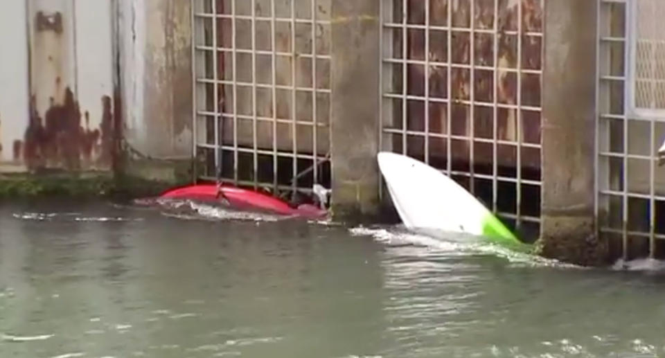 The current pulled the kayakers towards the metal grate. Source: 7 News