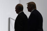 FILE - In this June 28, 2019, file photo, President Donald Trump and Russian President Vladimir Putin walk to participate in a group photo at the G20 summit in Osaka, Japan. (AP Photo/Susan Walsh, File)