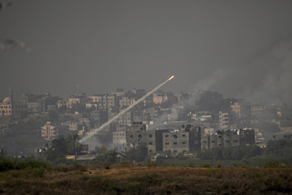 FILE - Rockets are fired toward Israel from the Gaza Strip, as seen from southern Israel, Monday, Oct. 23, 2023. The war between Israel and Hamas has brought carefully calibrated condemnations and warnings to both sides by Russia. (AP Photo/Ariel Schalit, File)