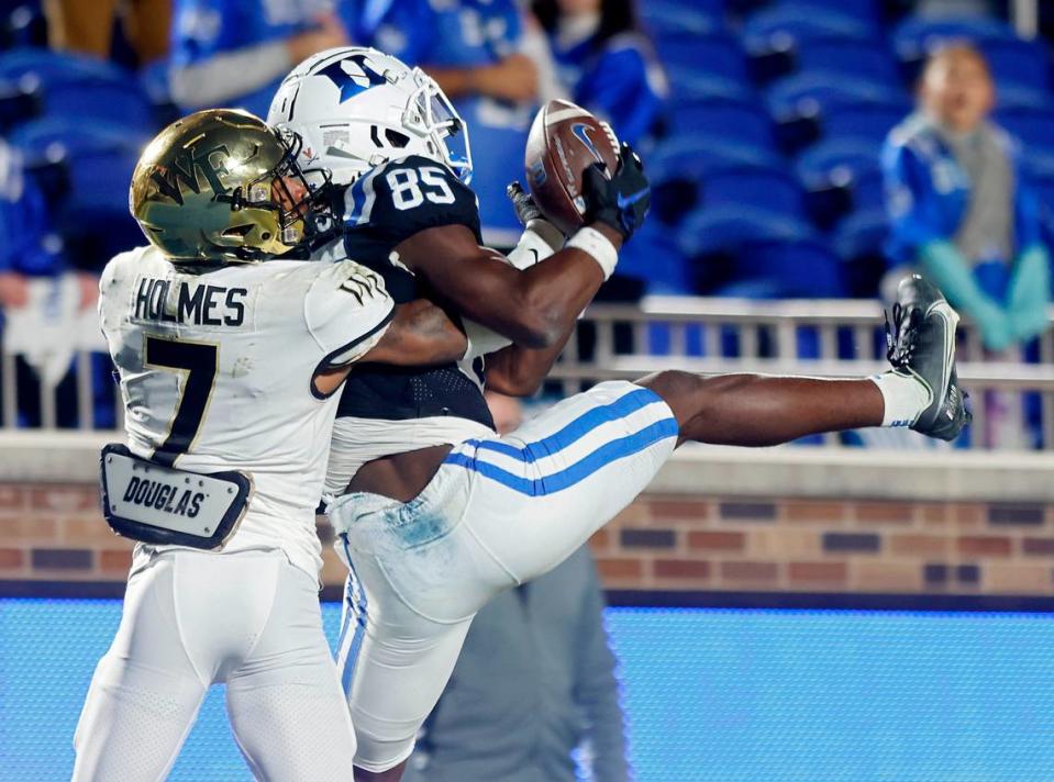 Duke’s Sahmir Hagans catches a pass over Wake Forest’s Gavin Holmes for a touchdown to give the Blue Devils a 34-31 lead with a little over two minutes remaining in Duke’s final regular season game at Wallace Wade Stadium on Saturday, Nov. 26, 2022, in Durham, N.C.