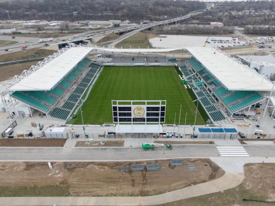 The teal colored seats of CPKC Stadium are covered by awnings intended to keep the sun and elements off of spectators in the seats.
