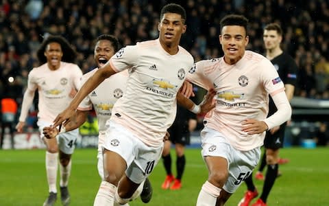 Manchester United's Marcus Rashford celebrates scoring their third goal with Mason Greenwood and Fred  - Credit: Reuters