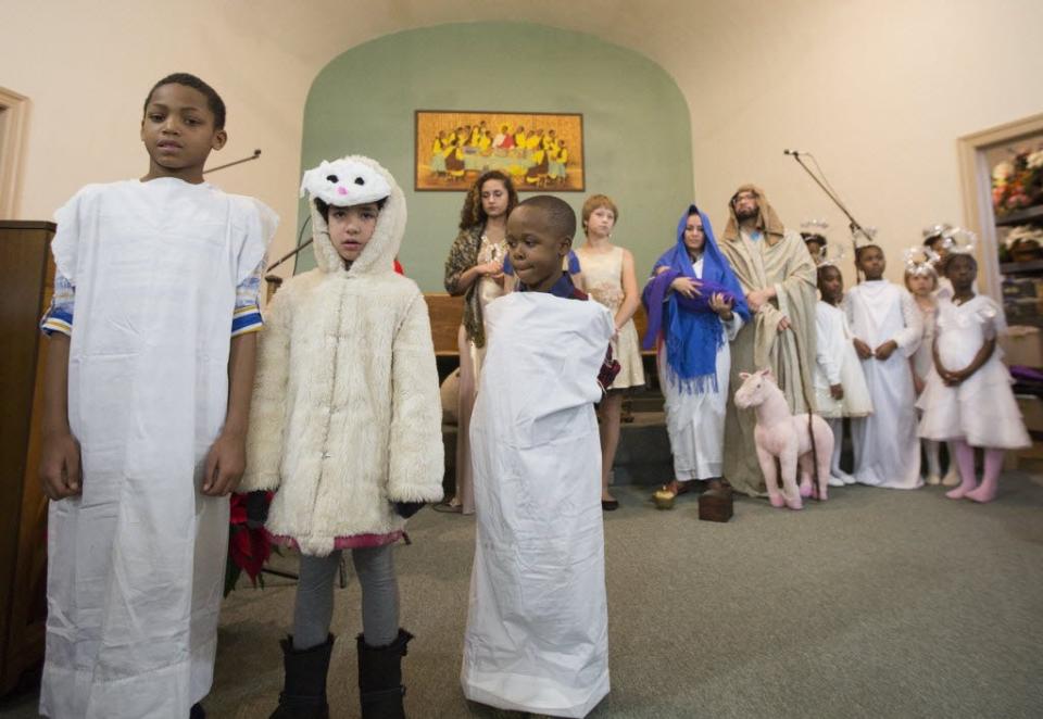 Children performers sing a song during a performance of The Nativity before the 4 p.m. Mass at St. Augustine Catholic Church in South Bend in 2015.