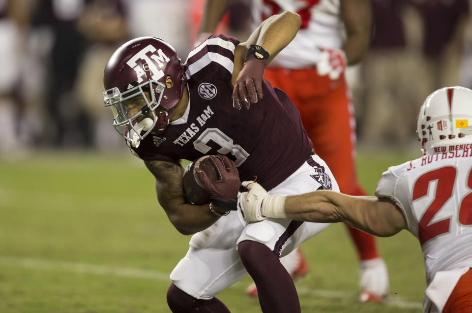 Texas A&M wide receiver Christian Kirk (3) shakes off a tackle-attempt on Saturday, Nov. 11, 2017, in College Station, Texas. (AP Photo/Sam Craft)