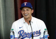 New Texas Rangers infielder Corey Seager speaks at a press conference at Globe Life Field Wednesday, Dec. 1, 2021, in Arlington, Texas. The Texas Rangers have finalized the contracts for their new half-billion dollar middle infield, wrapping up their deals Wednesday, Dec. 1, 2021 with two-time All-Star shortstop Corey Seager and Gold Glove second baseman Marcus Semien.(AP Photo/Richard W. Rodriguez)