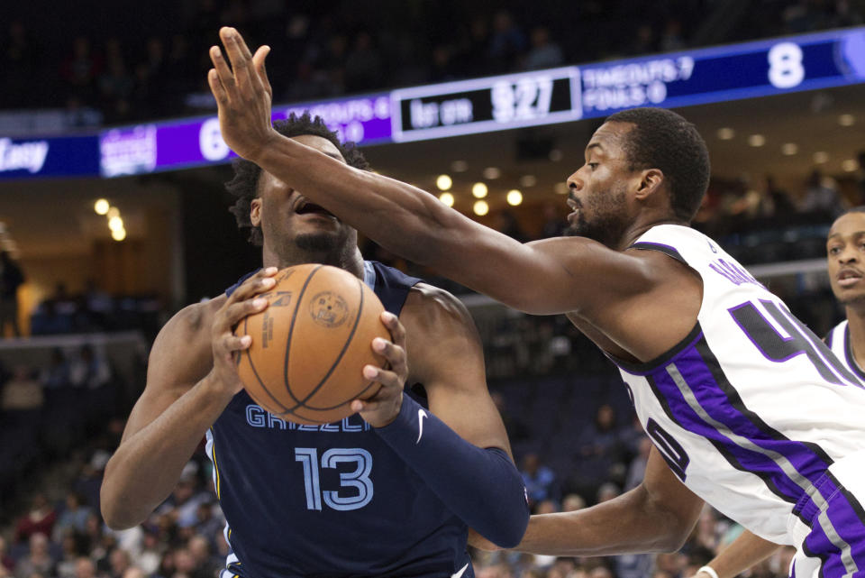 Sacramento Kings forward Harrison Barnes (40) defends against Memphis Grizzlies forward Jaren Jackson Jr. (13) in the first half of an NBA basketball game Monday, Jan. 29, 2024, in Memphis, Tenn. (AP Photo/Nikki Boertman)