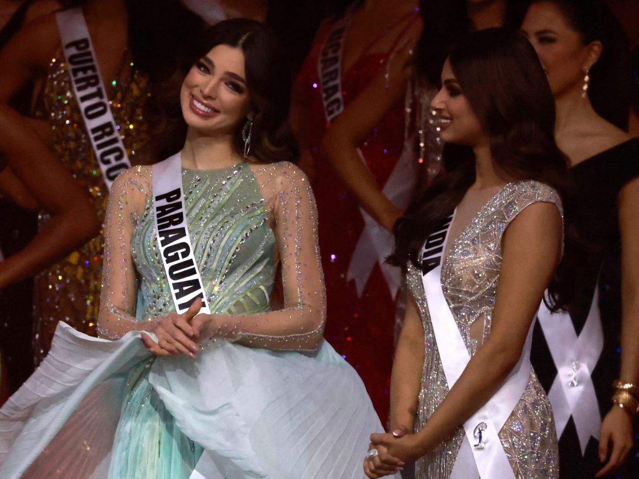 Miss Paraguay and Miss India on stage at the 2021 Miss Universe competition.