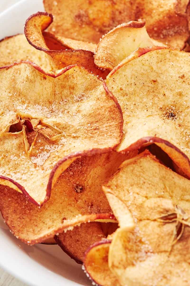 <p>Making your own apple crisps is very easy and it's a delicious healthy snack to have on hand and not to mention, one of our favourite apple recipes.</p><p>Get the <a href="https://www.delish.com/uk/cooking/recipes/a28995950/healthy-apple-chips-recipe/" rel="nofollow noopener" target="_blank" data-ylk="slk:Apple Crisps;elm:context_link;itc:0;sec:content-canvas" class="link ">Apple Crisps</a> recipe.</p>