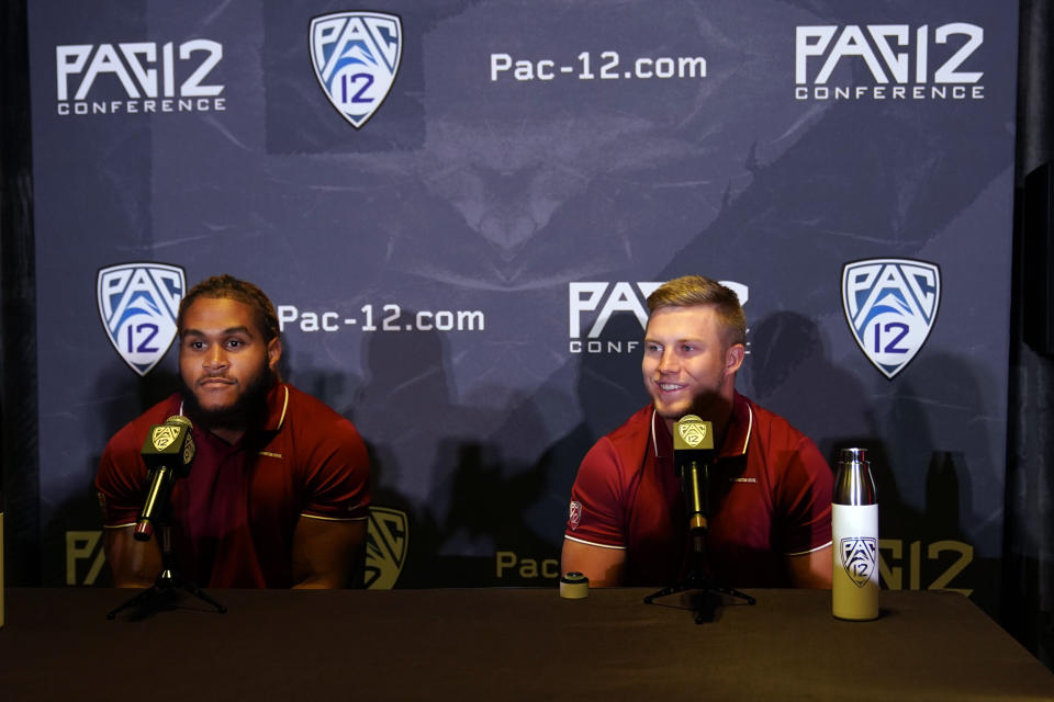 CORRECTS TO WASHINGTON STATE NOT WASHINGTON AS ORIGINALLY SENT - Washington State running back Max Borghi, right, and linebacker Jahad Woods field questions during the Pac-12 Conference NCAA college football Media Day Tuesday, July 27, 2021, in Los Angeles. (AP Photo/Marcio Jose Sanchez)