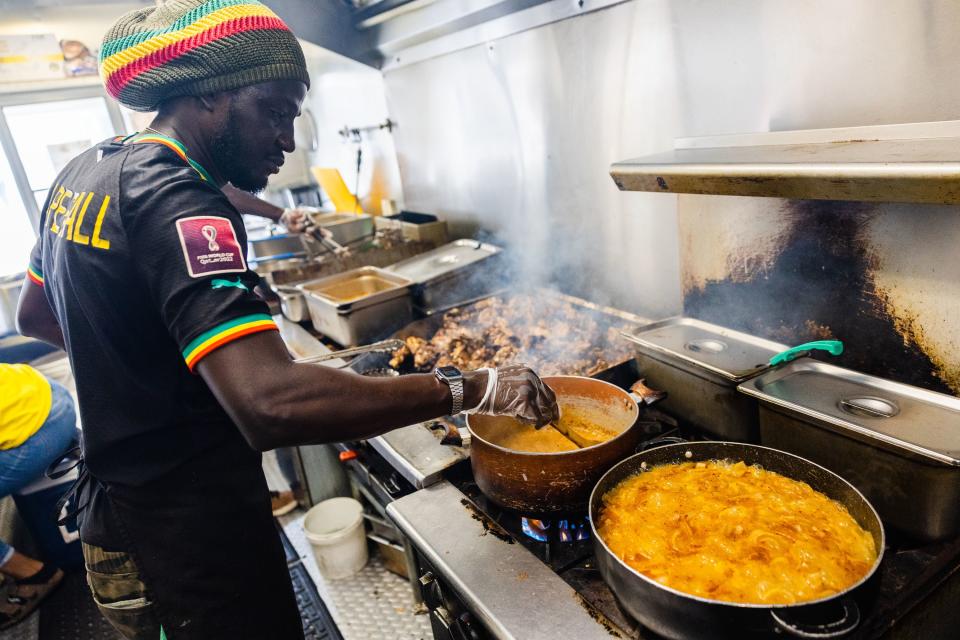 Pape Sall, owner of the Balabe Senegalese Cuisine food truck, cooks during the Juneteenth celebration at The Gateway in Salt Lake City on June 19, 2023. | Ryan Sun, Deseret News