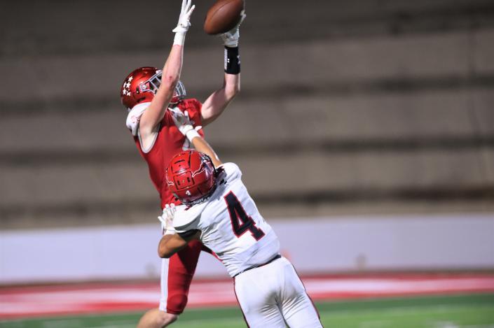 Sweetwater&#39;s Harrison Foster (4) goes up for a catch over Eastland&#39;s Jared Cruz (4) during an October game at the Mustang Bowl.