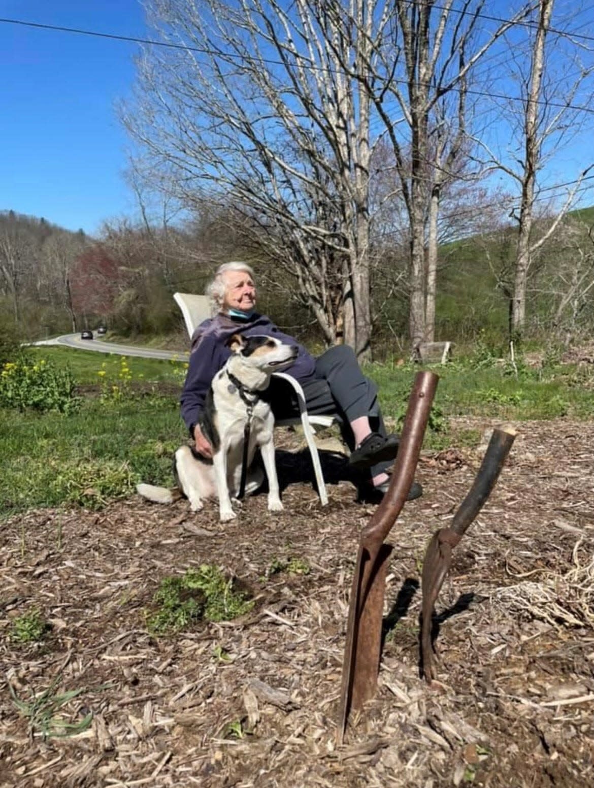 Artist Connie Bostic with her dog, Dexter, at their Fairview home.