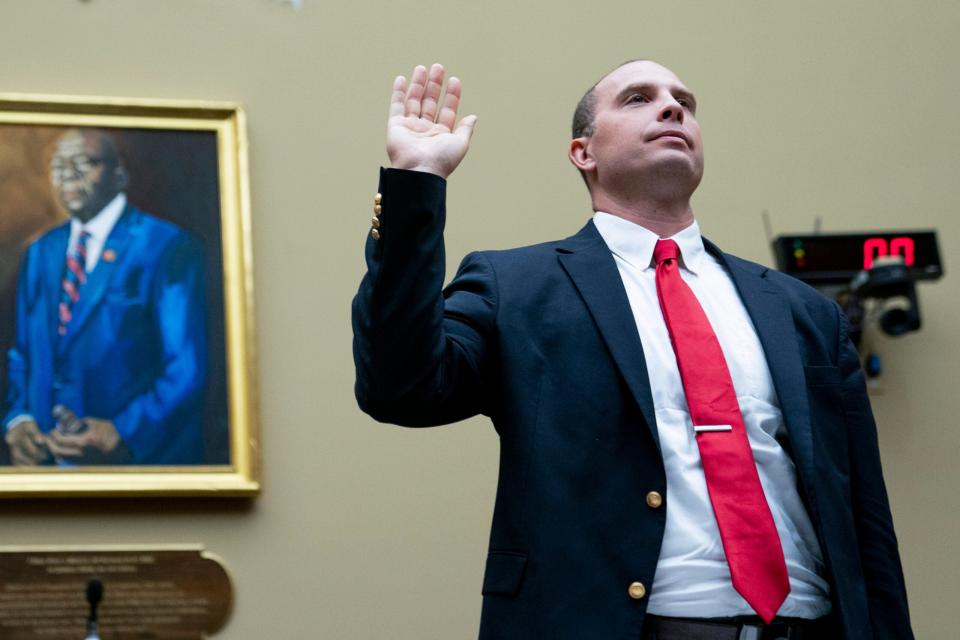 U.S. Air Force (Ret.) Maj. David Grusch, is sworn in before a House Oversight and Accountability subcommittee hearing on UFOs, Wednesday, July 26, 2023, on Capitol Hill in Washington. (AP Photo/Nathan Howard)