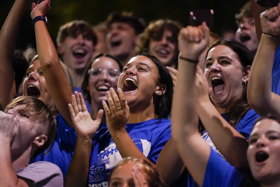 Fans attend a KHSAA high school football game between the Simon Kenton Pioneers and the Highlands Bluebirds at Highlands High School Friday, Aug. 26, 2022.