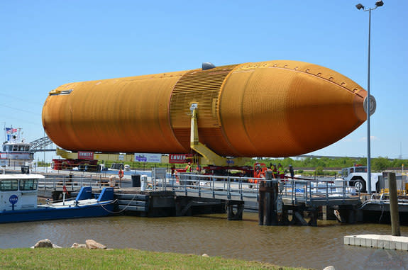 ET-94, the last of NASA's external tanks built to launch a space shuttle, was loaded onto a barge at the Michoud Assembly Facility in New Orleans on Sunday, April 10, 2016. The tank is destined for displa