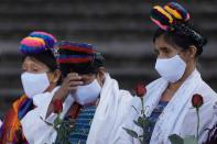 Women identified as victims of human rights violations during Guatemala's civil war, and their supporters, pray outside the Supreme Court in Guatemala City, Monday, Jan. 24, 2022. A decision at another court nearby is expected on Monday in the trial of five former civil defense patrolmen who fought alongside soldiers as civilians who are accused of sexual assault and human rights violations against dozens of Indigenous women from the Mayan Achi ethnic group. (AP Photo/Moises Castillo)