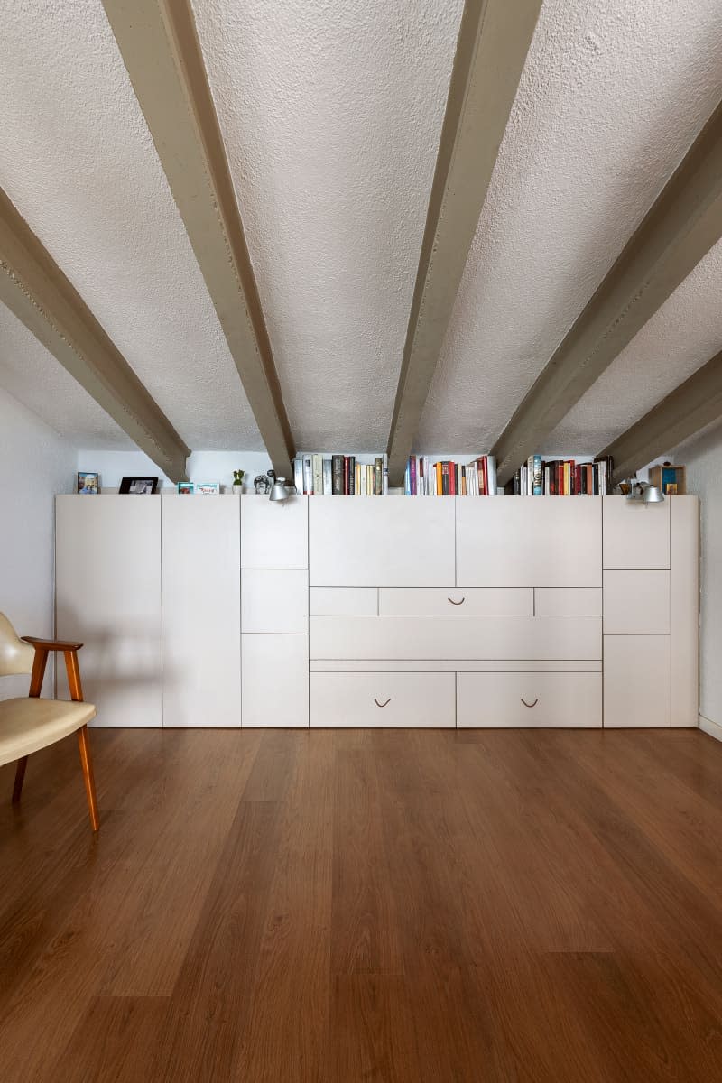 Modular wall unit in neutral toned room.