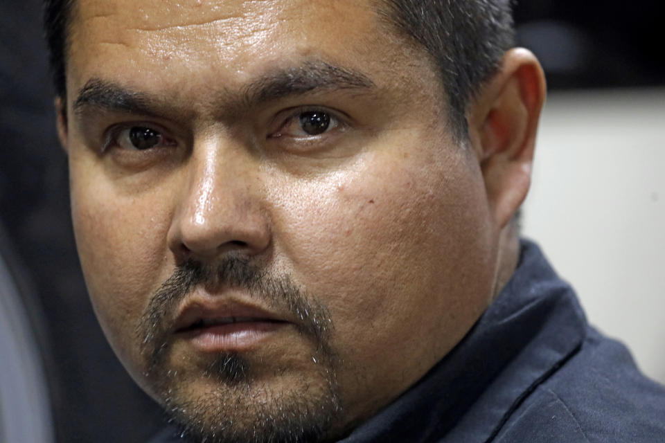 In this Nov. 22, 2019, photo, mechanic Miguel Borrayo works on a car in Ogden, Utah. Borrayo tried to find a lawyer to help him argue he should be allowed to stay in the country with his American-born children, despite lacking legal papers. But he was told it would cost up to $8,000 and he didn’t have a strong case. He was given a month to leave the country. (AP Photo/Rick Bowmer)