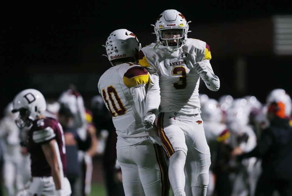 Ankeny football players celebrate after their 14-7 victory over Dowling Catholic in the Class 5A quarterfinals last week.