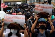 Anti-government demonstrators attend a protest march in Hong Kong