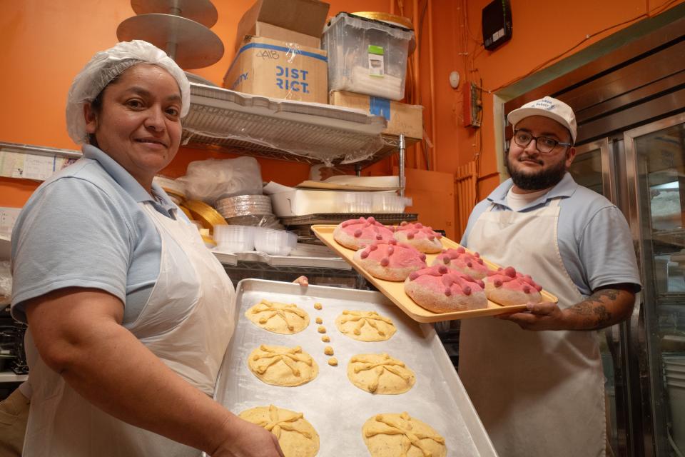 Bakers at La Purisima Bakery prepare batches of pan de muerto at the shop located near Glendale and 43rd avenues in Glendale.