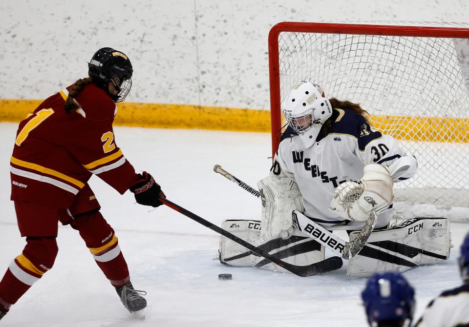 Webster’s Mia Wambach makes the save on this shot by Ithaca’s Hailey Baughan.