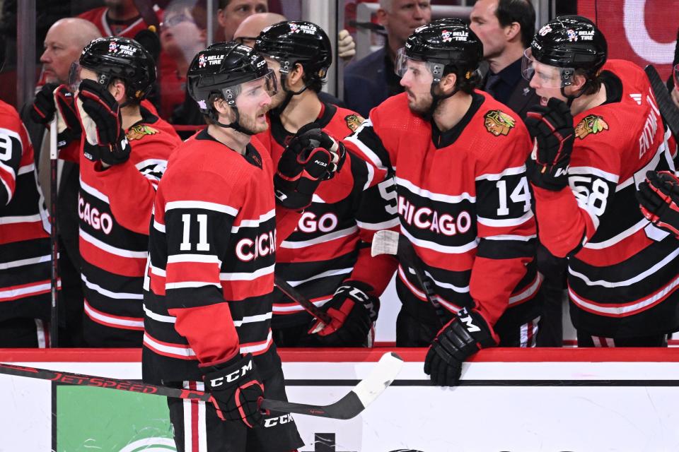 Taylor Raddysh of the Chicago Blackhawks celebrates with the bench after scoring a power play goal in the third period against the Montreal Canadiens on Nov. 25, 2022 at United Center in Chicago. Montreal defeated Chicago 3-2 in a shootout.