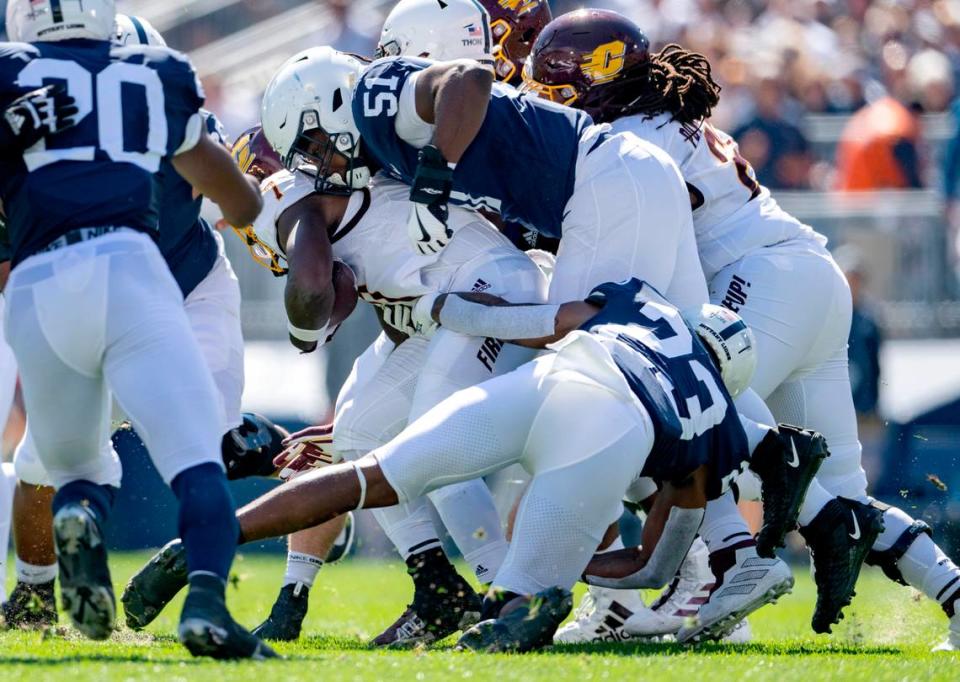 Penn State defensive end Hakeem Beamon and linebacker Curtis Jacobs stop Central Michigan’s Lew Nichols III during the game on Saturday, Sept. 24, 2022.