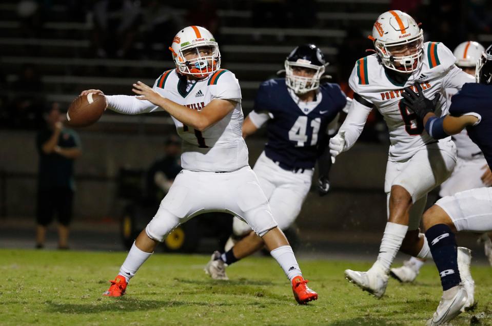 Porterville's Rocky Arguijo looks to pass against Redwood during their high school football game in Visalia, Calif., Friday, Oct. 7, 2022.