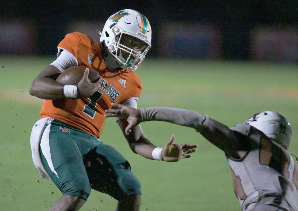 Mandarin's quarterback Tramell Jones (1) is stopped short of the goal line on his failed two-point conversion scramble during third-quarter action on Sept. 15. The Atlantic Coast Stingrays traveled to Mandarin to play the Mustangs.